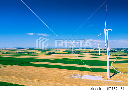 Aerial view of wind turbine. Windmills at harvest Aerial view of wind turbine. Windmills at harvest 67532121