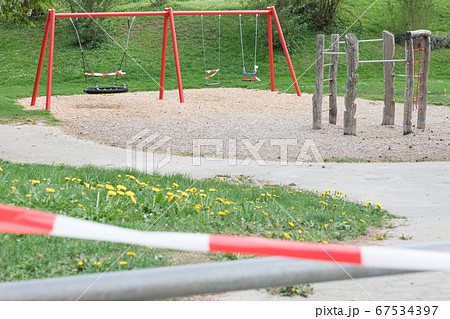 Corona virus quarantine lockdown playground swings 67534397