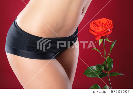 Beautiful slim woman in black panties body isolated on white background. Close up photo 67535507