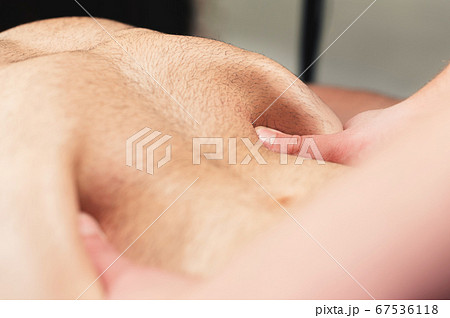 Close-up professional massage of the diaphragm to a man in a professional massage room. The concept of internal organs and abdominal cavity 67536118