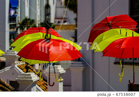 Colourful umbrellas urban street decoration. 67538007