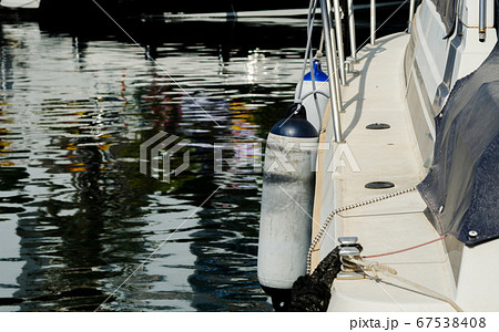 buoy hanging outside the hull of the boat, boat 67538408