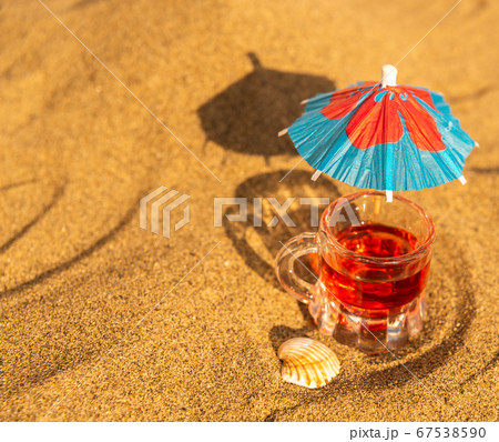 colorful shots drinks on a sandy beach with 67538590