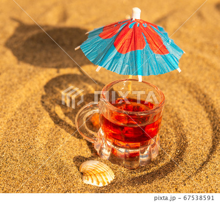 colorful shots drinks on a sandy beach with colorful shots drinks on a sandy beach with 67538591