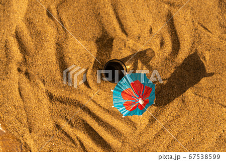 colorful shots drinks on a sandy beach with 67538599