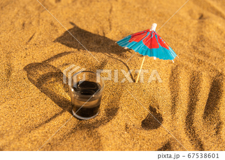 colorful shots drinks on a sandy beach with 67538601