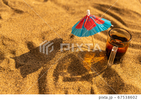 colorful shots drinks on a sandy beach with 67538602