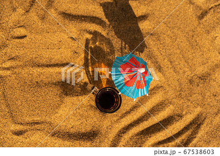 colorful shots drinks on a sandy beach with 67538603