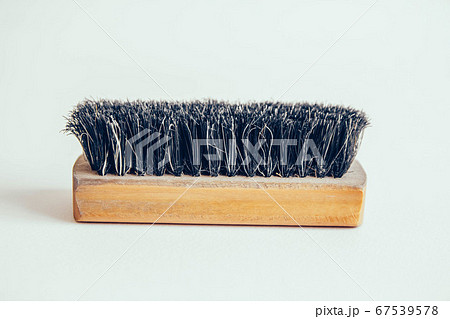 Wooden brush for clothes on a white background Wooden brush for clothes on a white background 67539578