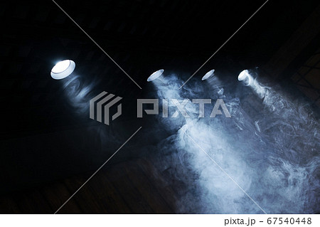 Lamps of light with a cloud of smoke. Close-up. 67540448