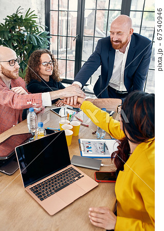 Group of joyful smiling happy people celebrate win with arms up. Mediation offer high five friendship deal achievement strike bargain good news friendly consent successful effective strategy 67540946