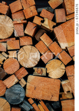 Stack of firewood logs texture background 67546876