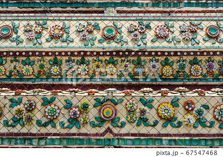 Thai Ornamental Pattern in Traditional Style is Decorated with Colorful Ceramic at Stupa of Wat Pho Monastery at Bangkok of Thailand. Thai Ornamental Pattern in Traditional Style is Decorated with Colorful Ceramic at Stupa of Wat Pho Monastery at Bangkok of Thailand. 67547468