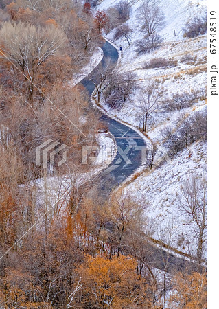 Curvy road on a snowy mountain in Salt Lake City Curvy road on a snowy mountain in Salt Lake City 67548519