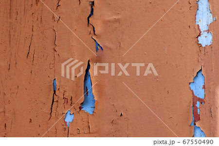 Paint that is cracked on the wall. 67550490