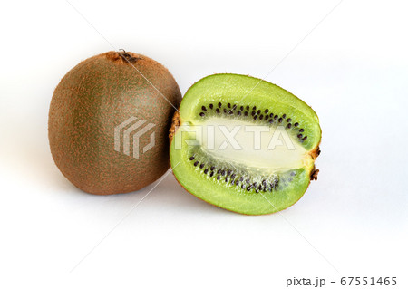 Whole and half-sliced kiwi on a white background 67551465