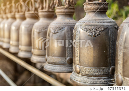 Old bell hangs on steel rail in The stone with the Old bell hangs on steel rail in The stone with the 67555371
