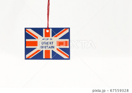 Cardboard tag on a string with a flag and the inscription made in great Britain.  67559328