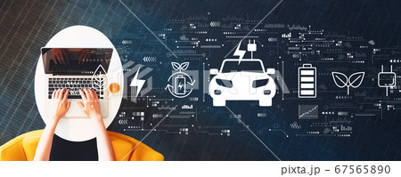 EV concept with person using a laptop EV concept with person using a laptop 67565890