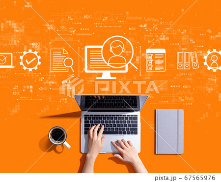 Document management system concept with person using a laptop 67565976