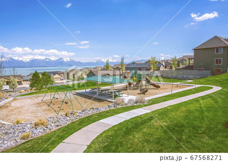 Houses and park with playground and picnic area on 67568271