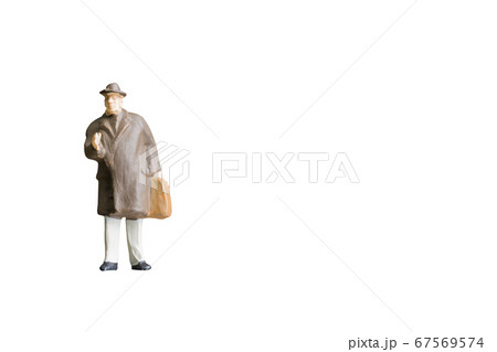 Miniature people isolated on white background 67569574