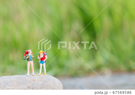 Traveler miniature mini figure with backpack , Travel and Adventure concepts Traveler miniature mini figure with backpack , Travel and Adventure concepts 67569586