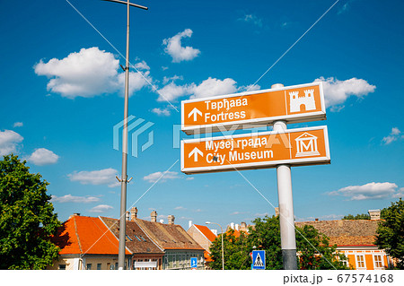 Petrovaradin medieval old town and tourist attractions arrow direction sign in Serbia 67574168