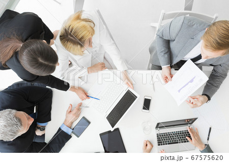 Business people at meeting Business people at meeting 67575620