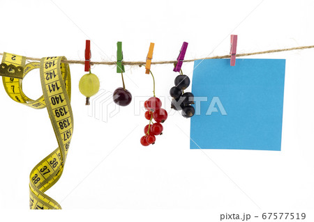 Fresh fruit, tape measure and blank sticky note Fresh fruit, tape measure and blank sticky note 67577519
