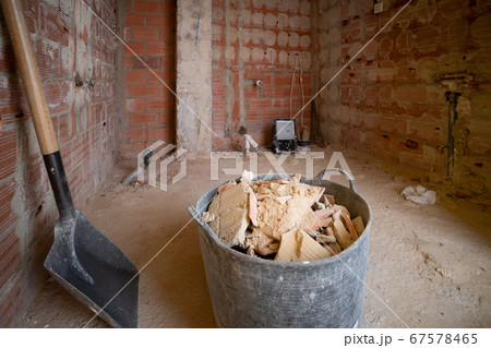 Bucket full of debris and a shovel Bucket full of debris and a shovel 67578465