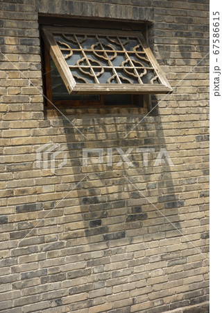 decorative window of a medieval building with geometrical patterns decorative window of a medieval building with geometrical patterns 67586615