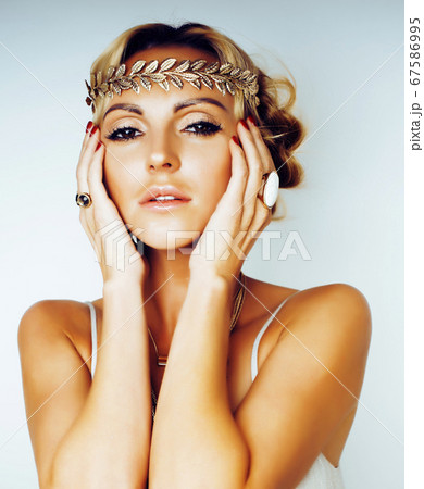 young blond woman dressed like ancient greek godess, gold jewelry close up isolated, summer trends young blond woman dressed like ancient greek godess, gold jewelry close up isolated, summer trends 67586995