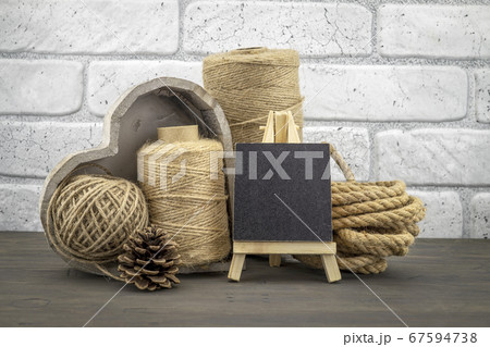 Assorted balls of hemp twine with rope and slate Assorted balls of hemp twine with rope and slate 67594738