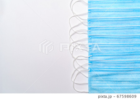 coronavirus COVID-19 pandemic concept - stack of antiviral surgical protective medical mask for protection against corona virus 67598609
