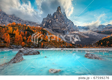Autumn alpine landscape with turquoise glacier lake, Sorapis, Dolomites, Italy 67599276