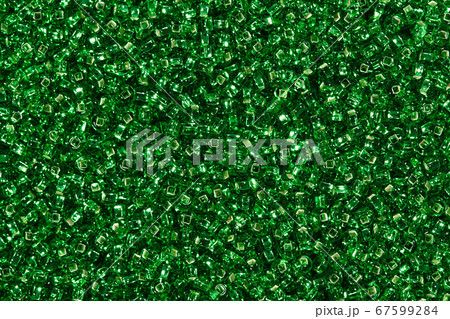 Close up of dark green glass beads background. Close up of dark green glass beads background. 67599284
