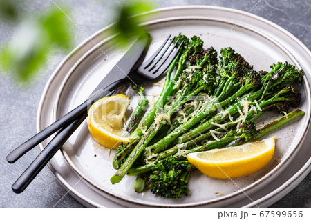 Roasted broccolini on the plate. 67599656