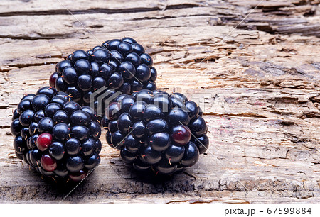 Three Large Blackberry Macro on wooden background Three Large Blackberry Macro on wooden background 67599884