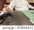 Interview with business man with empty glass 67604451
