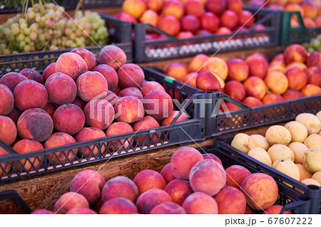 Fruit bazaar peaches grapes apricots ripe juicy 67607222