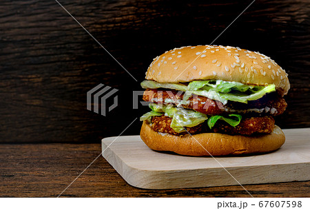 Hamburger a chicken on a wooden background 67607598