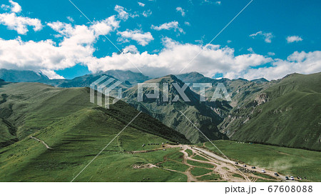 Panorama of beautiful springtime green hills of the mountain and the road 67608088