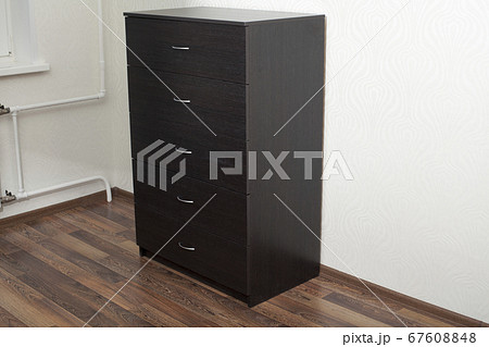 Wood furniture. Wooden dresser in room. 67608848