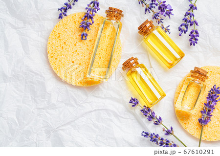 Lavender essential oil in small glass bottles 67610291