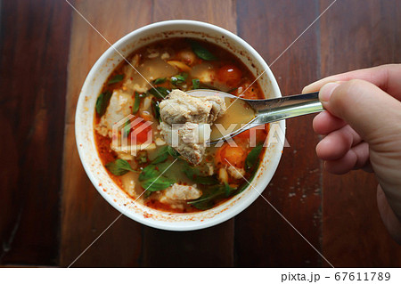 spicy soup or pork soup 67611789