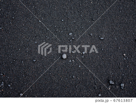 Black sand as a background in the Iceland sea shore.  67613807