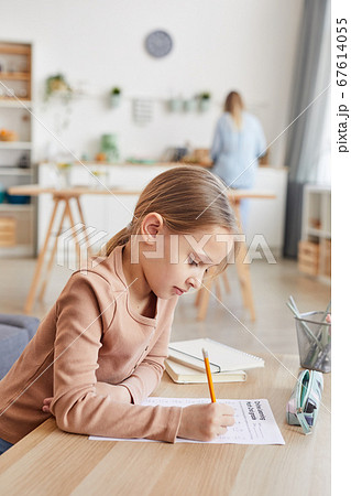 Cute Girl Writing Test at Home 67614055
