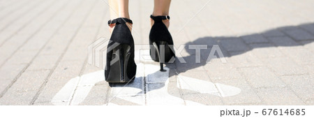 Lady walking on footpath 67614685