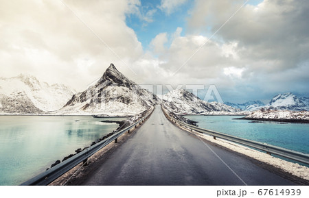 Olstind Mount and asphalt road. Lofoten islands, 67614939